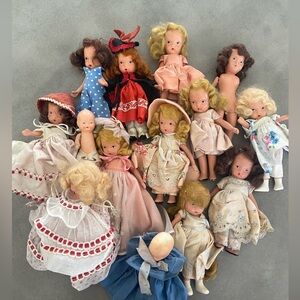 Bundle of antique porcelain dolls.
